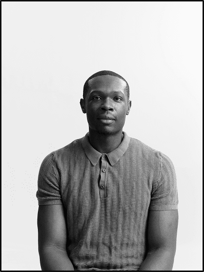 Portrait of Marvin Ngonadi, seated, in black and white
