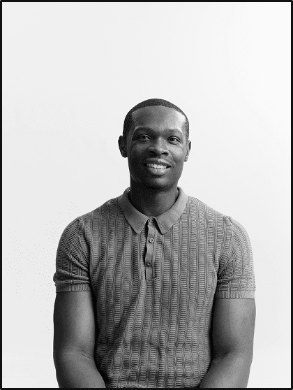 Portrait of Marvin Ngonadi smiling, in black and white